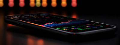 Smartphone Displaying Night Trading Chart