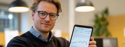 Man Displaying Trading App